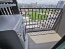 Balcony with washing machine and city view