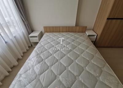 Bedroom with double bed and wooden headboard