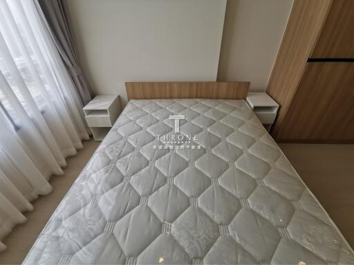 Bedroom with double bed and wooden headboard