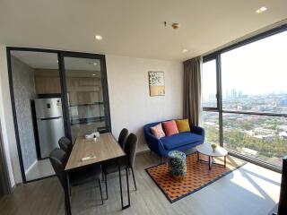 Modern living room with dining area and kitchen