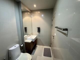 Modern bathroom with large mirror and contemporary fixtures