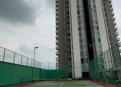 High-rise residential building with tennis court