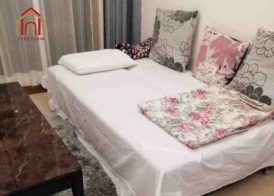 Living room with white couch and decorative pillows