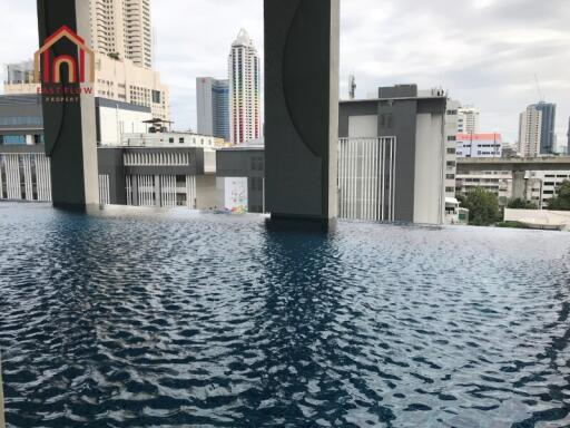 Modern cityscape view from rooftop pool