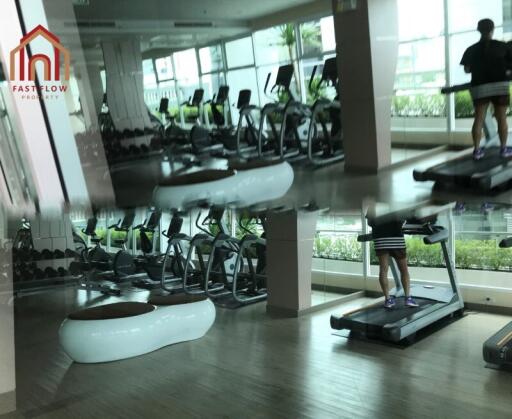 Well-equipped gym with various machines and green view