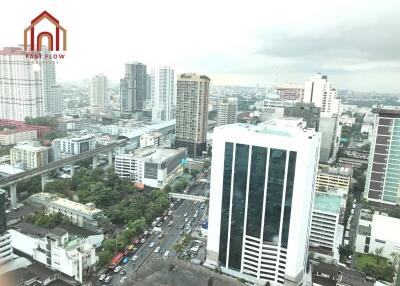 Aerial view of cityscape with skyscrapers and main road