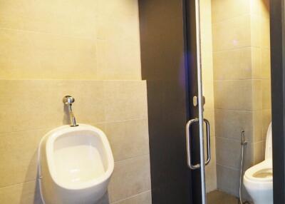 Modern bathroom with a urinal and toilet