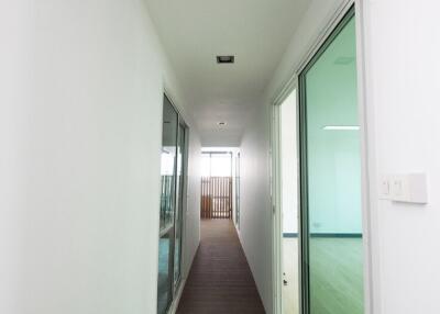 Long narrow hallway with large windows