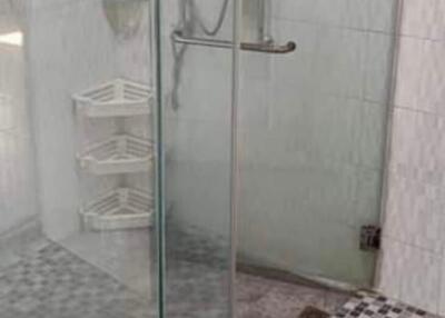 Modern bathroom with glass shower and tiled floor