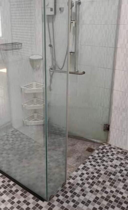 Modern bathroom with glass shower and tiled floor