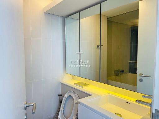 Modern bathroom with mirrored cabinet and sink