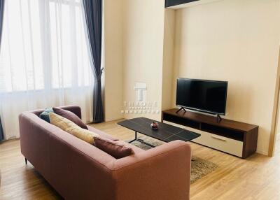 Living room with sofa, TV, and coffee table