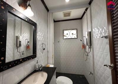 Modern bathroom with shower area and stylish fixtures