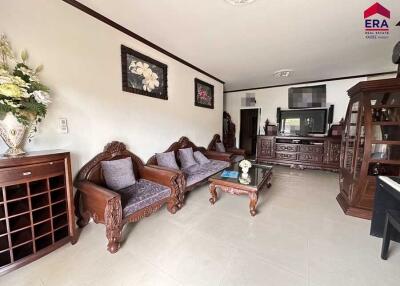 Spacious living room with traditional wooden furniture