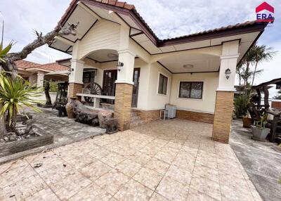 Front view of a house with a tiled patio