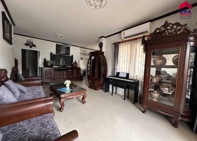 Spacious living room with traditional decor and modern amenities