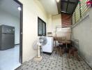 Utility room with appliances and small dining area