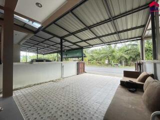 Covered outdoor area with seating and driveway