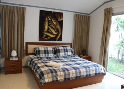 Bedroom with checkered bedding and modern decor