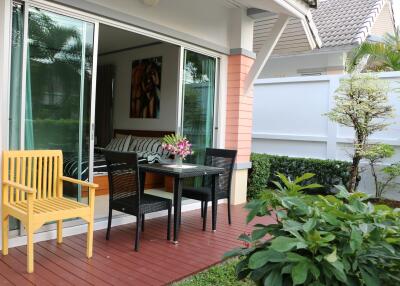 Outdoor patio with seating area and garden view