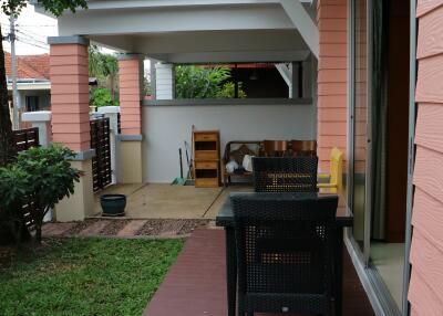 Outdoor patio with seating area and garden