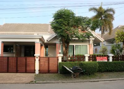 Front view of a house with a fenced yard