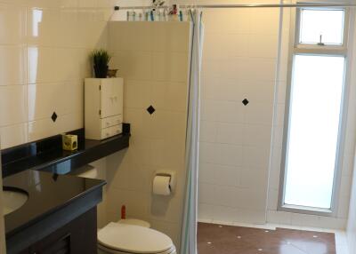 Bathroom with shower and vanity