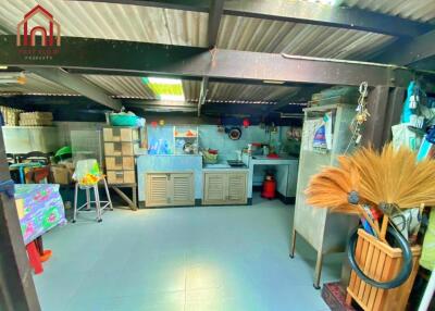 Spacious kitchen area with contemporary furnishings and good lighting.