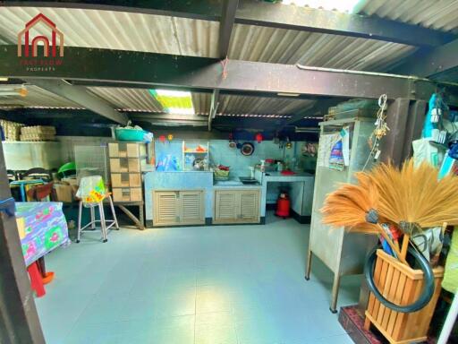 Spacious kitchen area with contemporary furnishings and good lighting.