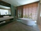 Modern bathroom with freestanding tub and walk-in shower