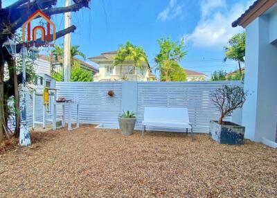 Outdoor area with seating and garden features