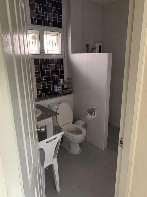 Clean and functional bathroom with toilet and sink