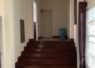 Interior hallway with dark wooden staircase