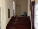 Interior hallway with dark wooden staircase