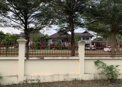 Exterior view of a house with front yard and trees