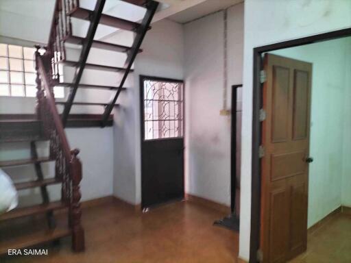 Interior view with staircase and door