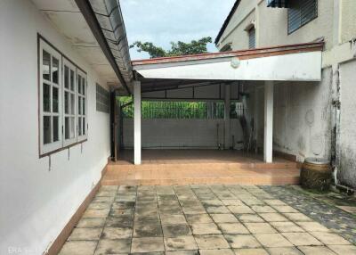 Covered patio area with tiled flooring in a residential property