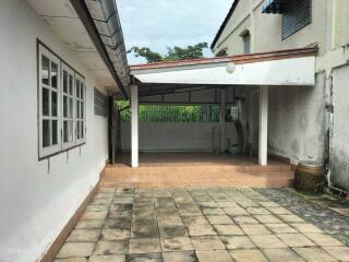 Covered patio area with tiled flooring in a residential property