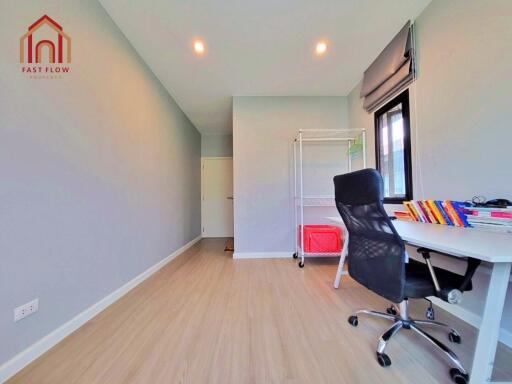 Modern bedroom with desk and shelving