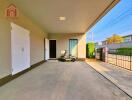 Spacious garage area with storage and outdoor access