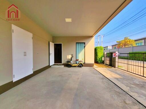 Spacious garage area with storage and outdoor access