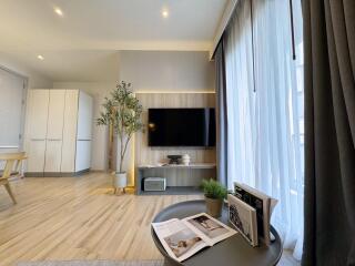 Modern living room with TV and natural light