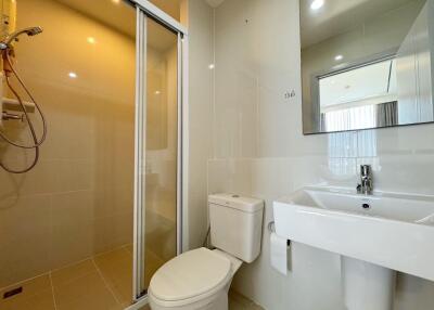 Modern bathroom with shower, toilet, and sink