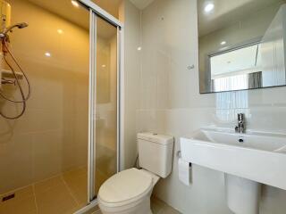 Modern bathroom with shower, toilet, and sink