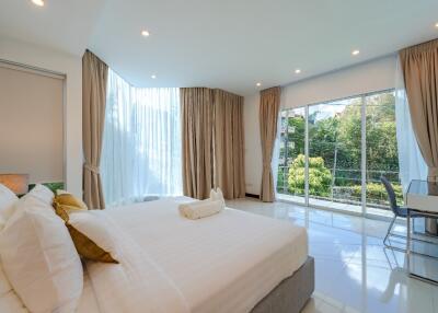 Bright and spacious bedroom with large windows