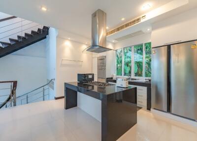 Modern kitchen with stainless steel appliances and an island