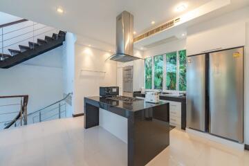 Modern kitchen with stainless steel appliances and an island