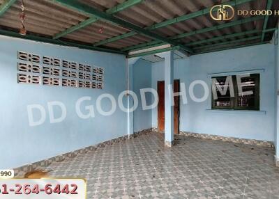 Empty room with tiled floor and metal roof