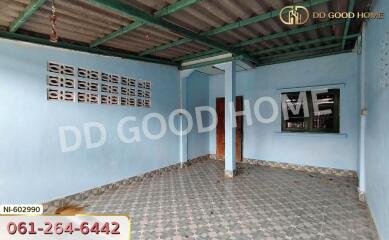 Empty room with tiled floor and metal roof