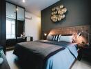 Modern bedroom with decorative wall art and bedside lamps